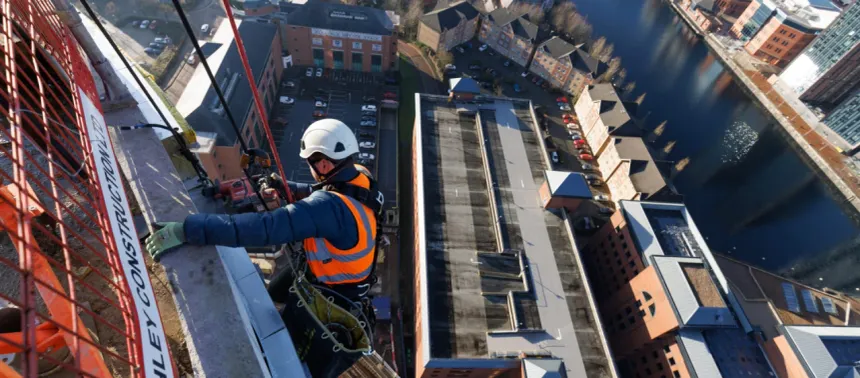 Rope access technician on building facade Hyderabad